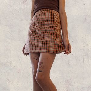 orange and black checkered skirt